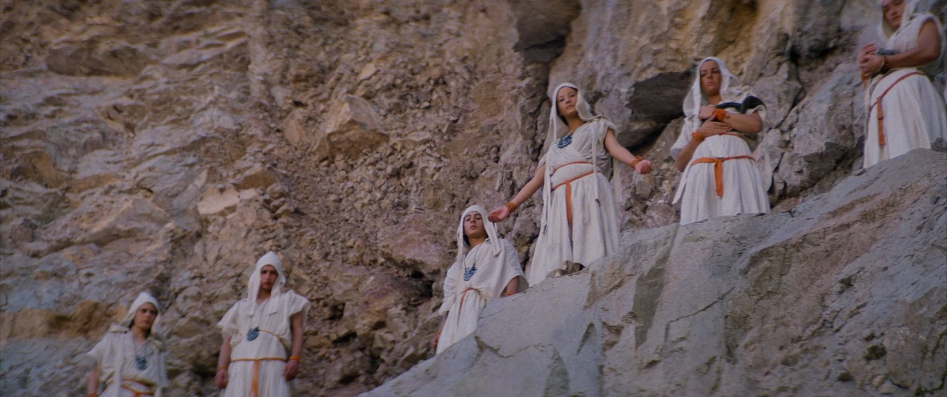 women on a cliff, a beautiful one told to jump to her death