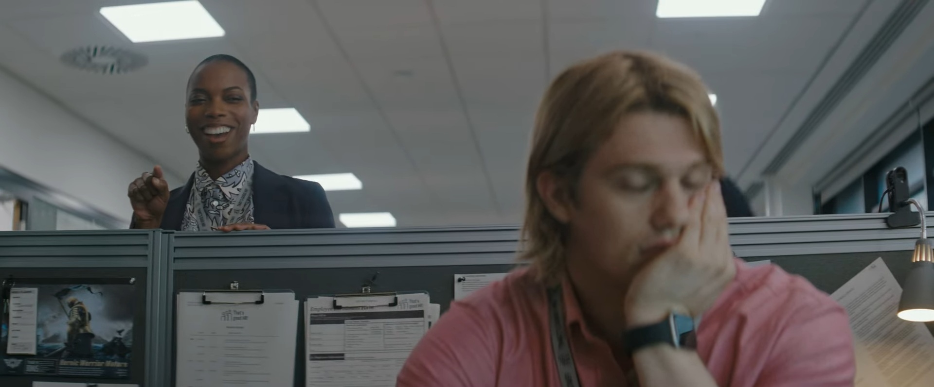 Adam (Nicholas Galitzine) sleeping with his manager (Sasheer Zamata) in background