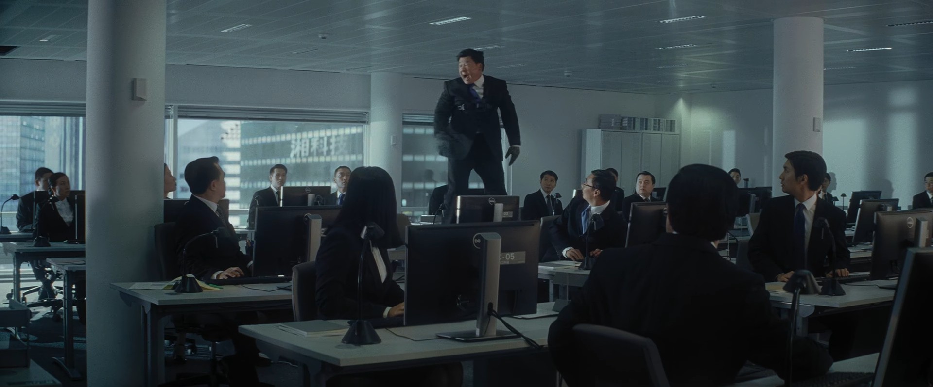 Man at workplace standing on desks
