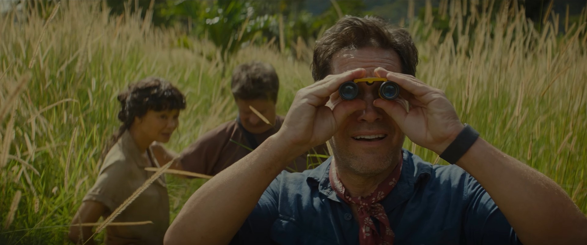 The Anaconda movie crew looking at Doug with binoculars